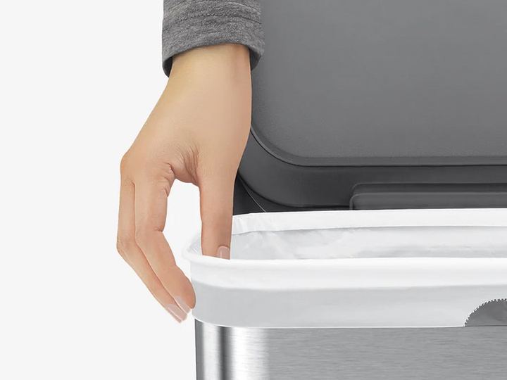 simplehuman liner fitted over a steel bin rim